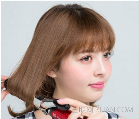 丸子头怎么扎出蓬松感   三联